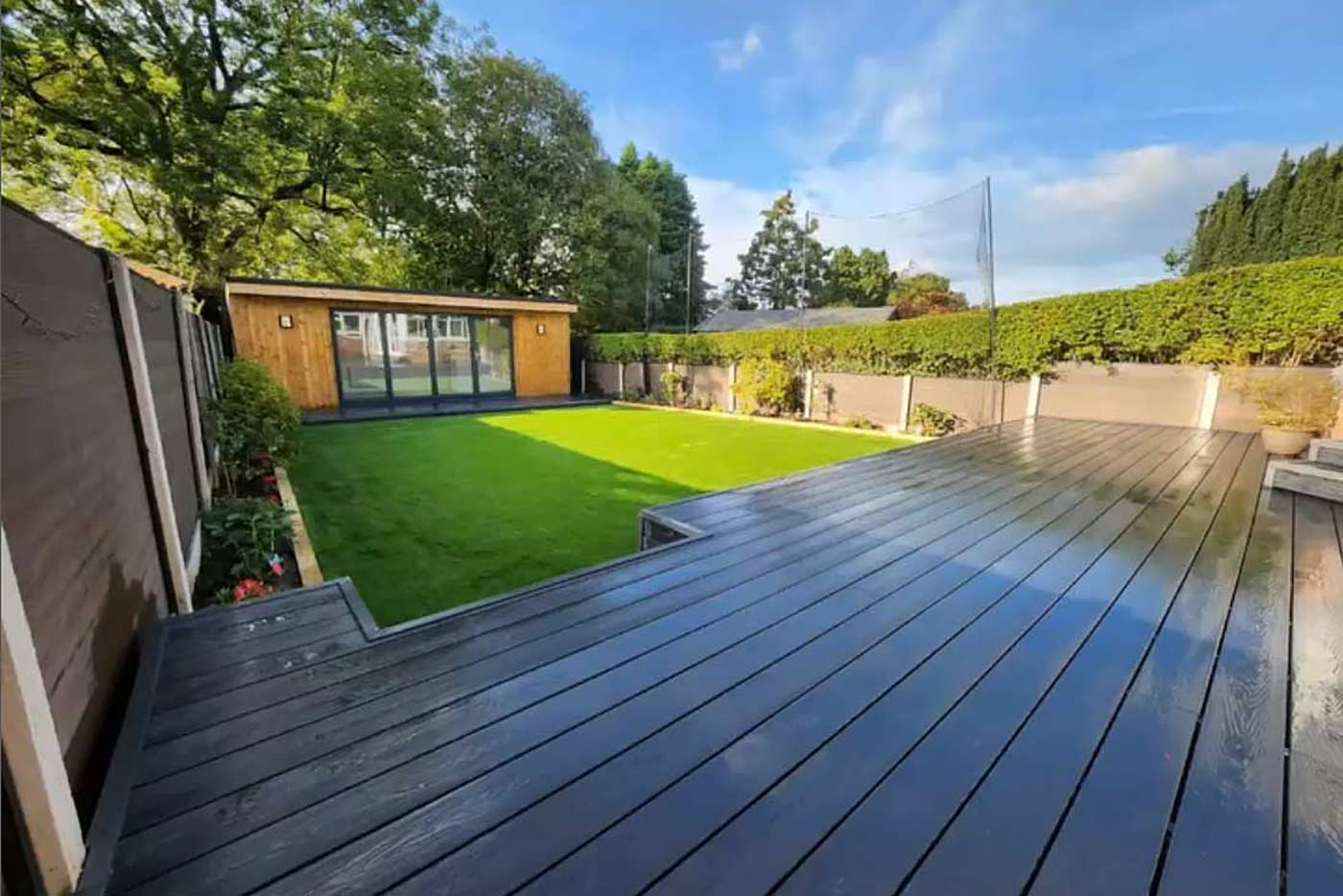 A garden room, landscape gardening and decking by Prima Construction, professional Master Builders in Stockport.