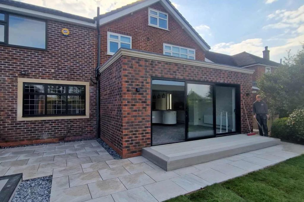 A patio and house extension in Stockport by Prima Construction.