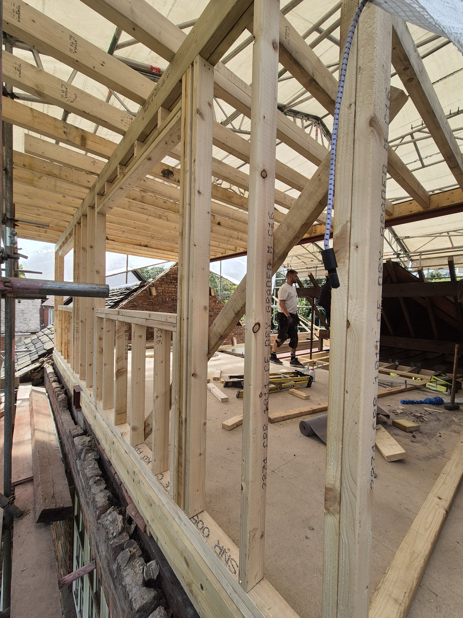 A loft conversion project with new timbers in place by Prima Construction
