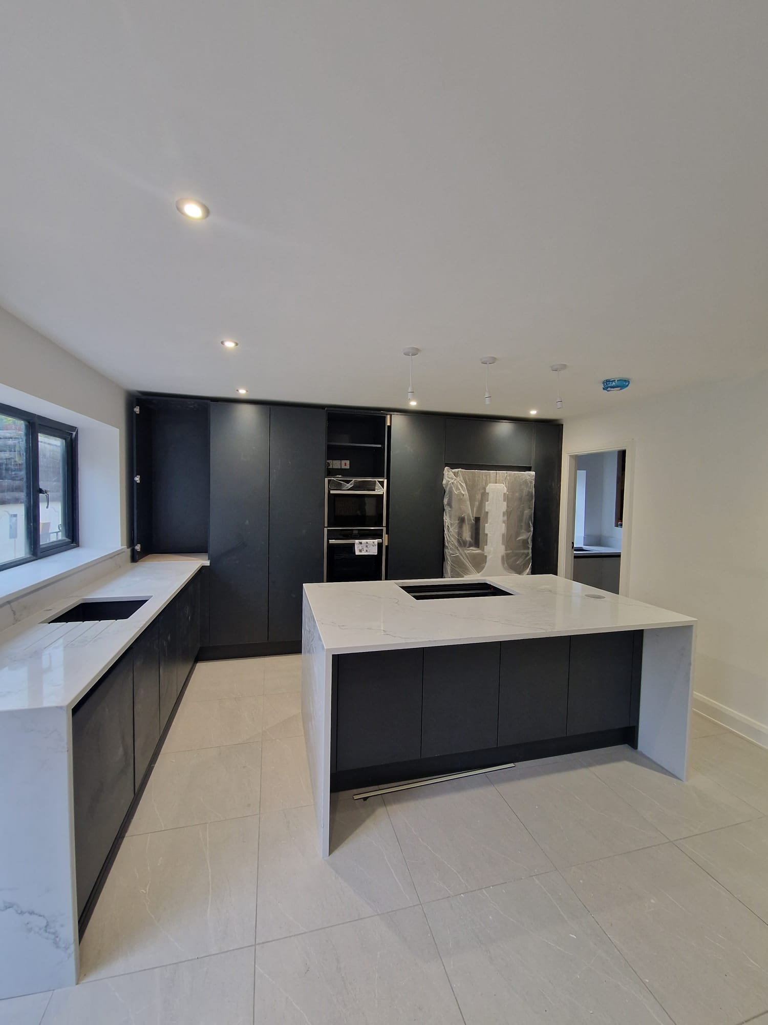 Modern kitchen fitted into an extension built on a Stockport home by Prima Construction