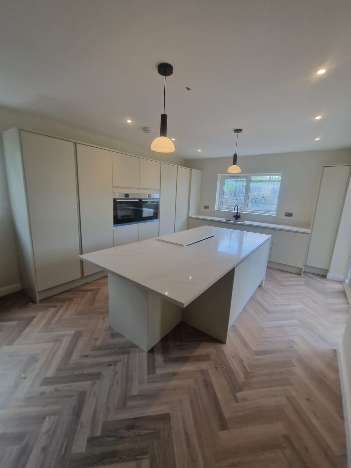 Herringbone floor in a new kitchen installed in a property refurbishment in Stockport